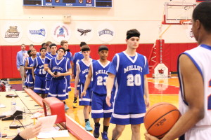 Members of the Archbishop Molloy H.S. Varsity ‘B’ basketball team line up to shake hands after finishing as the runner-up in this year’s championship. (Photo by Jim Mancari)