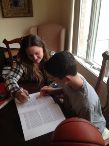 St. Francis College senior Lauren McNair serves as the tutor for RENS basketball player Jonathan Hahami. (Photo courtesy St. Francis College)