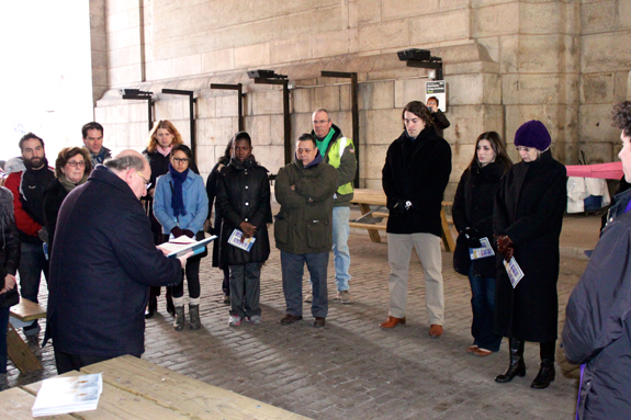 Father James King, pastor of Assumption parish, Brooklyn Heights, leads the faithful of the DUMBO section of Brooklyn in a prayer service on Ash Wednesday at the “Arch” under the Manhattan Bridge. 