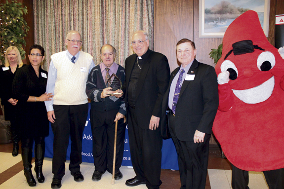 St. Columba parish, Marine Park, took top honors from the New York Blood Center (NYBC) at a ceremony in Douglaston. From left are Lydia Phang NYBC, Deacon Larry Coyle, Charles Gelo, Bishop Nicholas DiMarzio and Paul DePaolo.