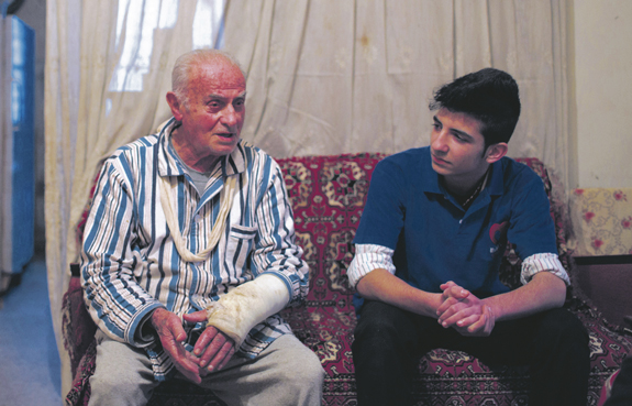a Lebanese man talks with another student.