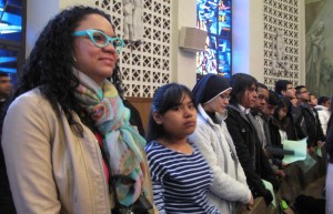 Youth are intently listening during Mass.