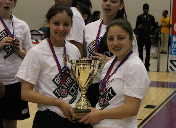 Bishop Kearney seniors Emily Hiltunen, left, and Christina Heyer, right, pose with the cup after their overtime victory over the PSAL. (Photo by Jim Mancari)
