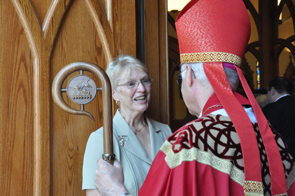 Fran Sullivan chats with Auxiliary Bishop Raymond Chappetto, following a special Mass on the one-year anniversary of Bishop Sullivan’s death.