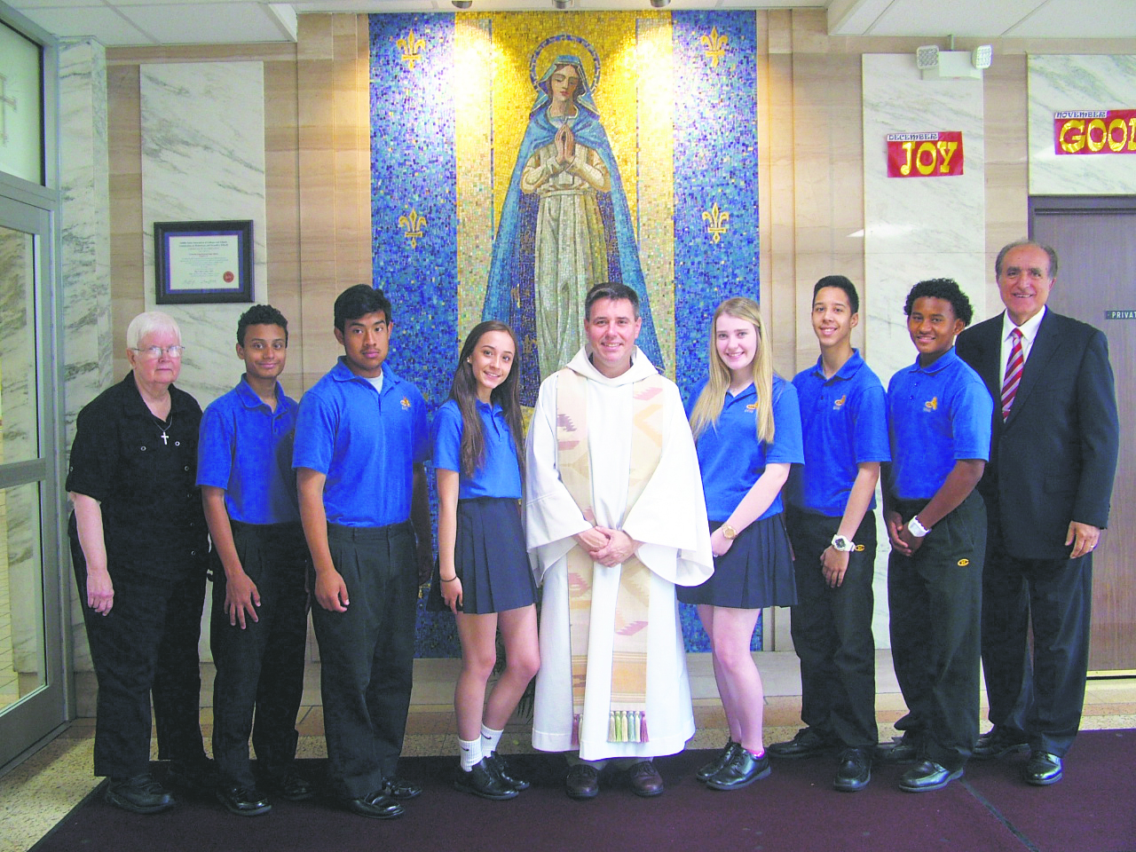Pictured above are installed extraordinary ministers of Holy Communion from Christ the King R.H.S., Middle Village: Aaron Arana, Edison Cahuana, Meagan Fontanez, Juan Obregon, Elizabeth Quagliariello and Frankelly Rosado, along with Principal Peter Mannarino, Father Frank Spacek, chaplain, and campus minister Sister Elizabeth Graham, C.S.J.  