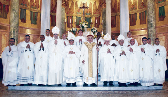 The ordination class and bishops. From left are Fathers Vincenzo Cardilicchia, Carlos Velasquez, Juan Luxama, Anthony Rosado, Auxiliary Bishop Paul Sanchez, Father Gregory McIlhenney, Auxiliary Bishop Octavio Cisneros, Father Marcin Chilczuk, Bishop Nicholas DiMarzio, Father Evans Julce, Auxiliary Bishop Raymond Chappetto, Father Robert Pierre-Louis, retired Auxiliary Bishop Guy Sansaricq, Fathers Cezariusz Jastrzebski, Peter Penton, Jason Espinal, Jeremy Canna and Felix Herrera.
