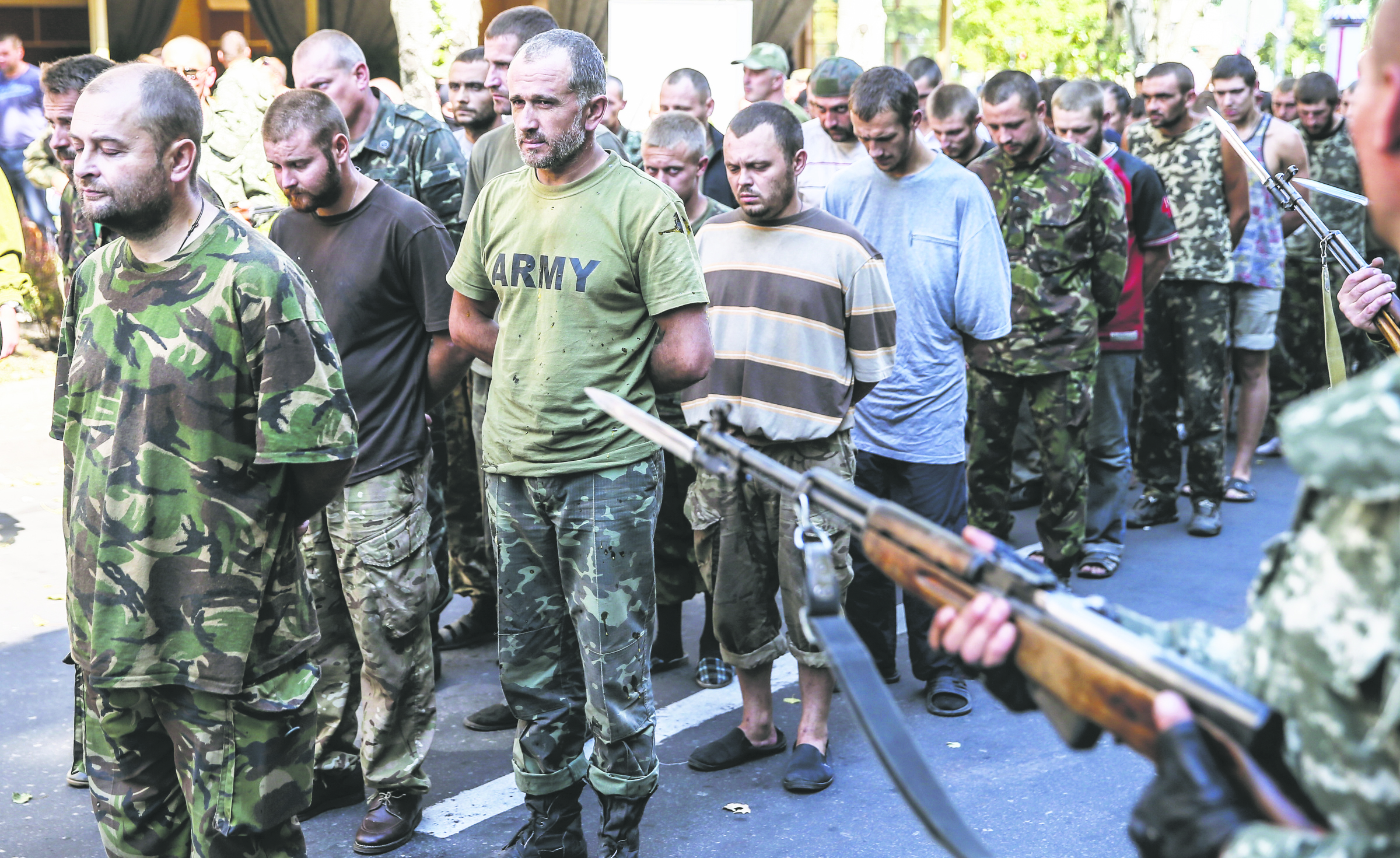 Military personnel of the self-proclaimed Donetsk People’s Republic escort Ukrainian army prisoners of war Aug. 24 in downtown Donetsk, Ukraine. Pope Francis prayed for peace in Ukraine during his weekly Angelus prayer.  Photo © Catholic News Service/Sergei Ilnitsky