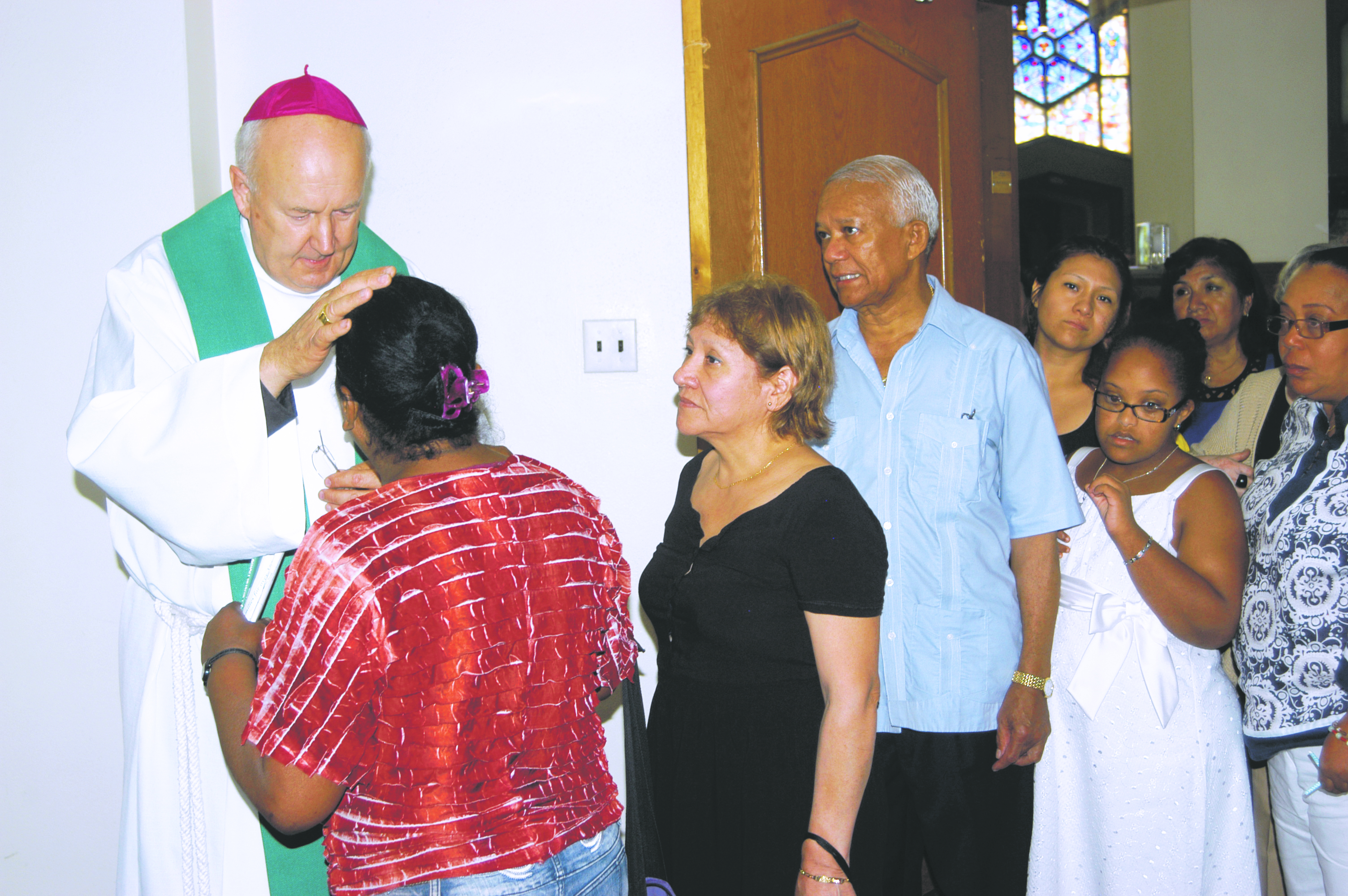 At St. Michael Church, Flushing, Msgr. Steenson greets and blesses former Episcopalians who are seeking full communion with the Catholic Church. Photo © Marie Elena Giossi