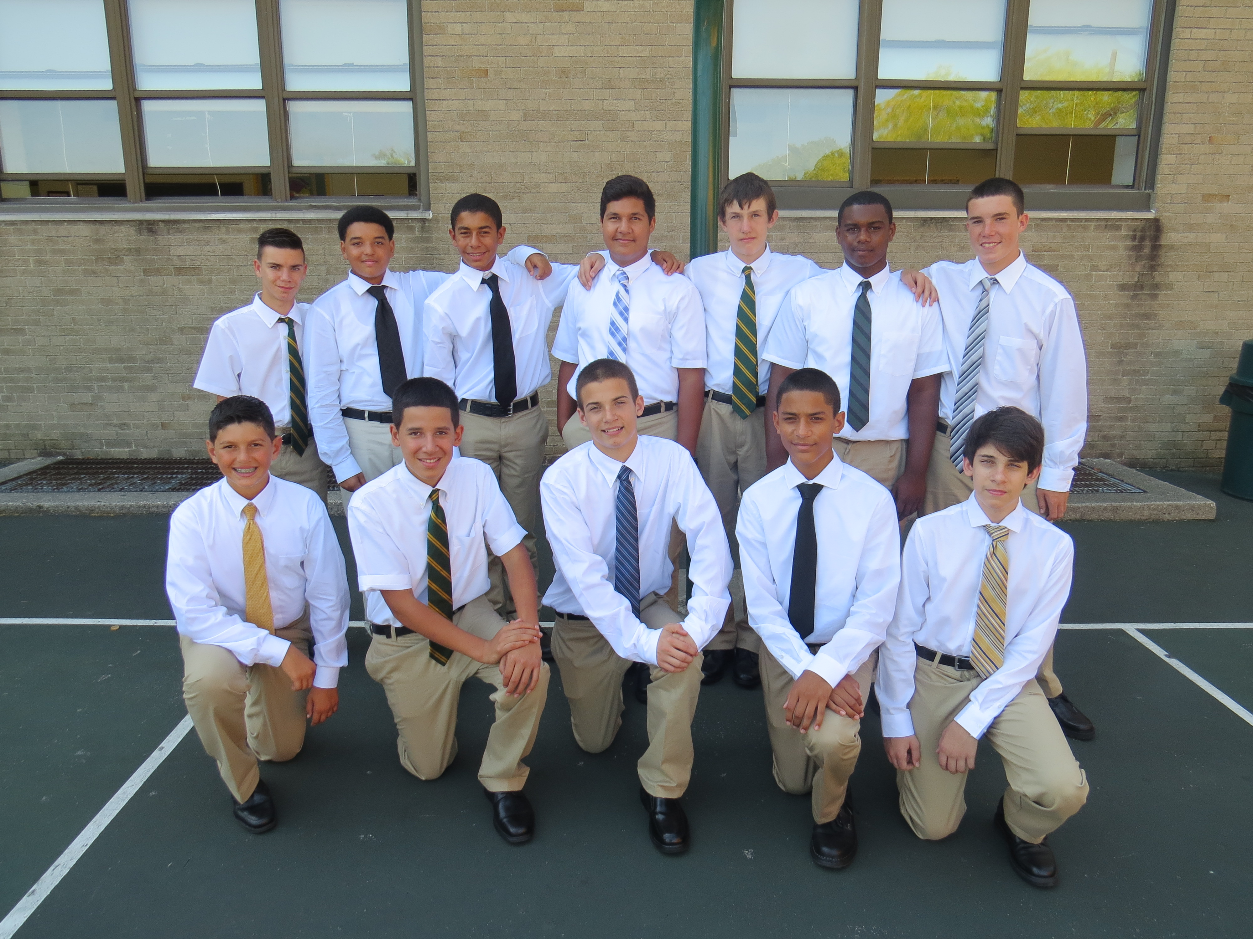 Holy Cross freshmen get acquainted at Orientation Day. Standing from left are Christopher Georgiadis, Tyler Lawson, Hassan Hassan, Christopher Goris, Joseph Higgins, Christian Mason and Thomas Leuthner; kneeling, from left are Achilleas Karangunis, Christian Mateo, Nicholas Forgione, Nicholas Gutierez and Christopher Kyriacou. 