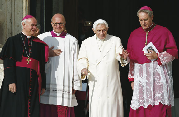 Retired Pope Benedict XVI arrives for Pope Francis’ encounter with the elderly in St. Peter’s Square at the Vatican. Also pictured are Archbishop Vincenzo Paglia, president of the Pontifical Council for the Family; U.S. Msgr. Peter B. Wells, a high-ranking official at the Vatican Secretariat of State; and Archbishop Georg Ganswein, prefect of the papal household.