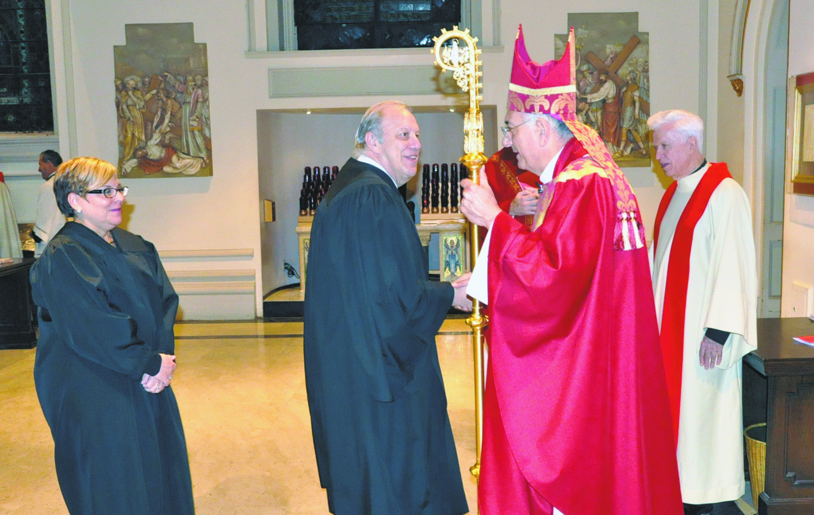 Bishop Nicholas DiMarzio greets Justices Robert Miller and Theresa Ciccotto, following the Red Mass at St. James Cathedral-Basilica, Downtown Brooklyn.