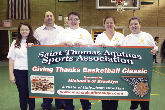 The McCarthy family, from left, Emma, Ed Sr., Eddie Boy, Ann and Aine, enjoyed a weekend of basketball at St. Thomas Aquinas’ first annual “Giving Thanks” Hoops Classic (Photo by Jim Mancari)