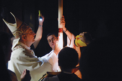 Bishop DiMarzio engraves Paschal Candle 