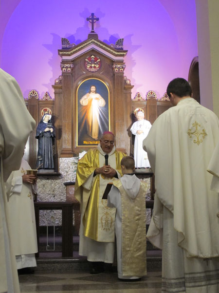 Bishop Nicholas DiMarzio blesses a newly dedicated chapel to Divine Mercy at Our Lady of Miraculous Medal Church, Ridgewood, during a special Mercy Hour Mass on Divine Mercy Sunday.