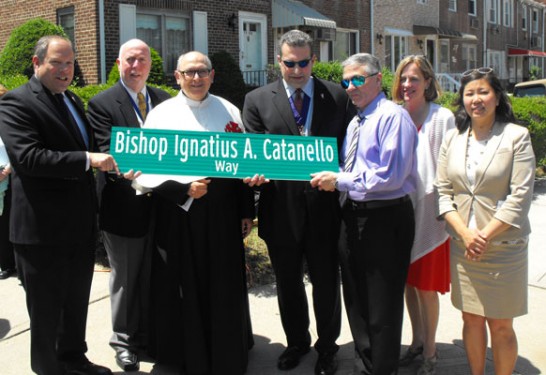 At the co-naming of a street for Bishop Catanello were, from left, City Councilman Rory Lancman; Holy Family Knight of Columbus John McArdle; Father Casper Furnari, pastor of Holy Family parish; Grand Knight Peter Petrino; Deacon Joseph Catanello; Queens Borough President Melinda Katz and Congresswoman Grace Meng. (Photo by Mike Rizzo)