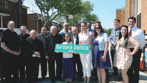 The Dattilo family and present and past clergy of Our Lady of Grace Church were at the unveiling of Barbara Dattilo Way.