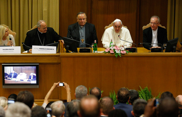 Pope Francis addresses a workshop on climate change and human trafficking attended by mayors from around the world in the synod hall at the Vatican July 21. Local government leaders were invited to the Vatican by the pontifical academies of sciences and social sciences to sign a declaration recognizing that climate change and extreme poverty are influenced by human activity. (CNS photo/Paul Haring)