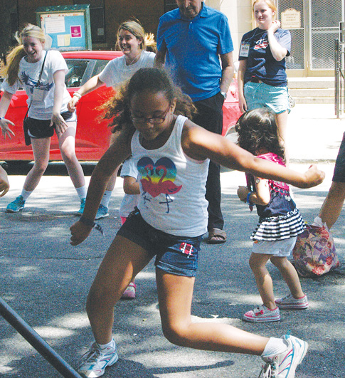 More than 800 children and adults enjoyed sidewalk games at the seventh annual Kids Fun Day Aug. 7. 