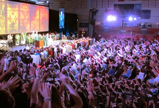 Nearly 2,000 teens raise their hands to bless peers who have recognized a possible calling to the priesthood or religious life. During the conference, at least five young people expressed a desire to receive the sacraments of initiation.