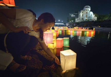Prayer for peace on 70th anniversary of Hiroshima bombing. (Photo by Paul Jeffrey)(Photo by Paul Jeffrey)
