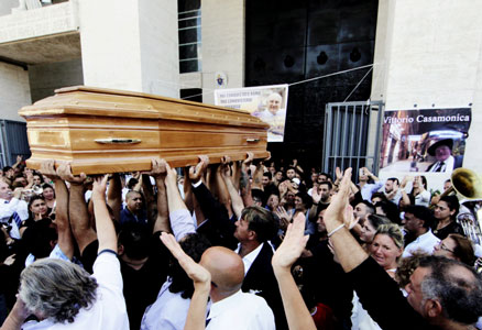 People carry the casket of Vittorio Casamonica into St. John Bosco Church in Rome for his Aug. 20 funeral Mass. (Photo by Catholic News Service/ Reuters) 