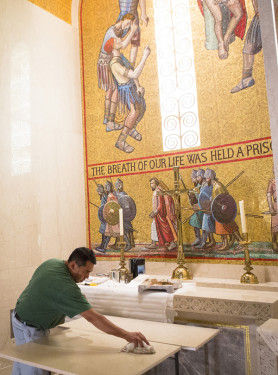 Santiago Sanchez, a decorative painter from Woodbridge, Va., marbleizes particle board for an altar Pope Francis will use for the canonization Mass of Blessed Junipero Serra at the National Shrine of the Immaculate Conception. Photo © Tyler Orsburn