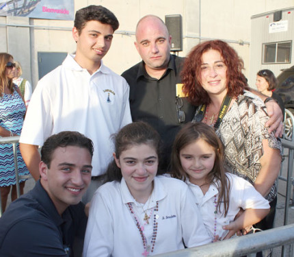 After receiving a blessing from the pope, Julia Bruzzese, front row, center, with her parents, Enrico and Josephine, and siblings, Adam, James and Sophia, believes a miracle will happen for her.  