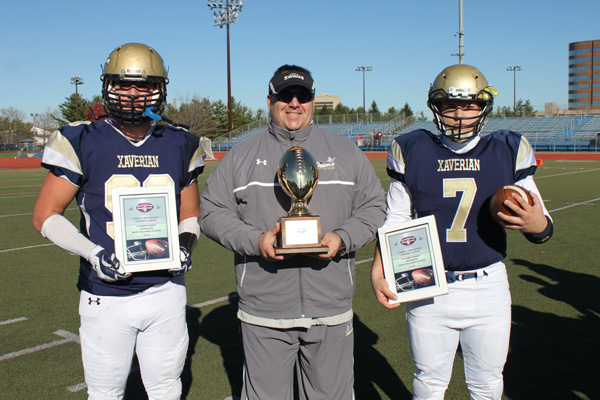 p From left, Defensive Player of the Game junior Michael Marinelli; Xaverian head coach Mike Jioia; and Offensive Player of the Game Phil DePaulis. (Photos © Jim Mancari)