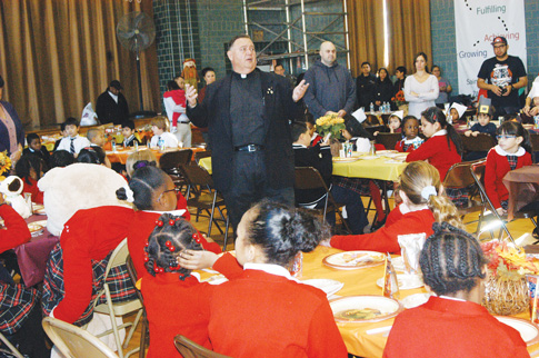 Father Robert Mucci, pastor of St. Mark Church, celebrated Mass for the school and led children in saying grace.