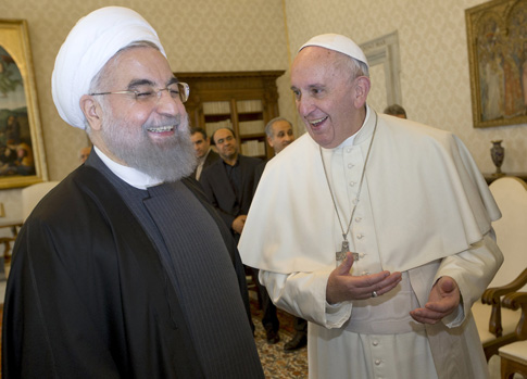 Pope Francis shares a light moment with Iranian President Hassan Rouhani during a private meeting at the Vatican Jan. 26. (CNS photo/Andrew Medichini, pool via Reuters)