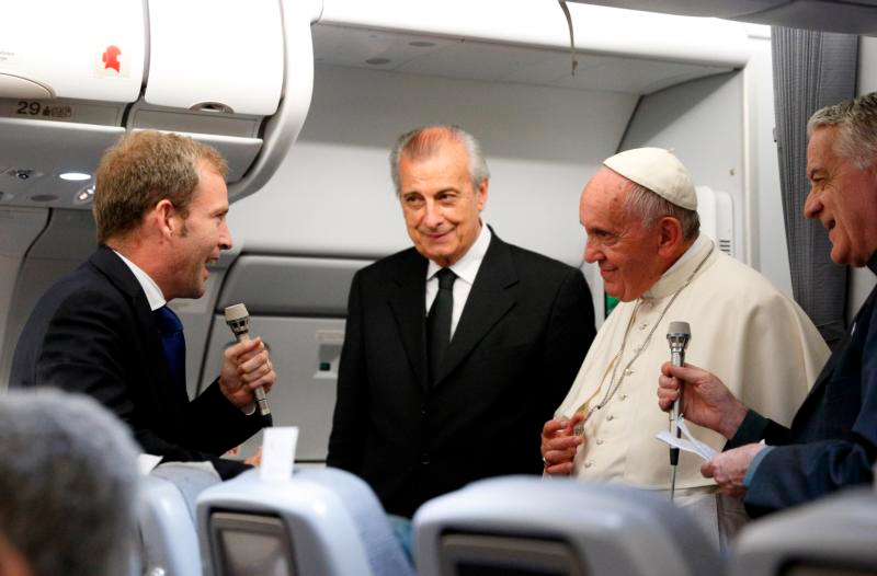 Pope Francis listens to a question from Javier Martinez-Brocal of Rome Reports while giving a press conference aboard his flight from Asuncion, Paraguay, to Rome in this July 12, 2015, file photo. Photo © Catholic News Service/ Paul Haring