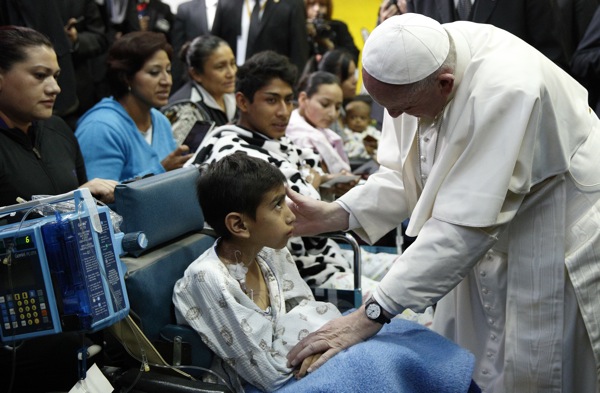 Pope Francis greets a sick child during a visit to the Federico Gomez Children's Hospital of Mexico in Mexico City Feb. 14. (CNS photo/Paul Haring) 