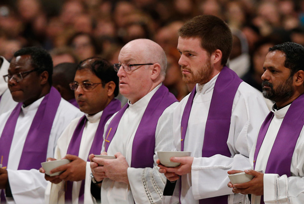 Priests who are "missionaries of mercy" for the Holy Year hold bowls of ashes as Pope Francis celebrates Ash Wednesday Mass in St. Peter's Basilica at the Vatican Feb. 10. (CNS photo/Paul Haring) 