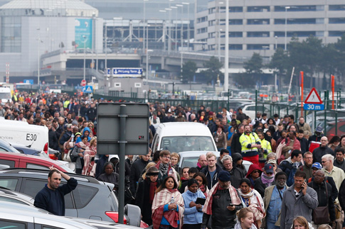 People evacuate Zaventem airport after explosions near Brussels March 22. (CNS photo/Laurent Dubrule, EPA)