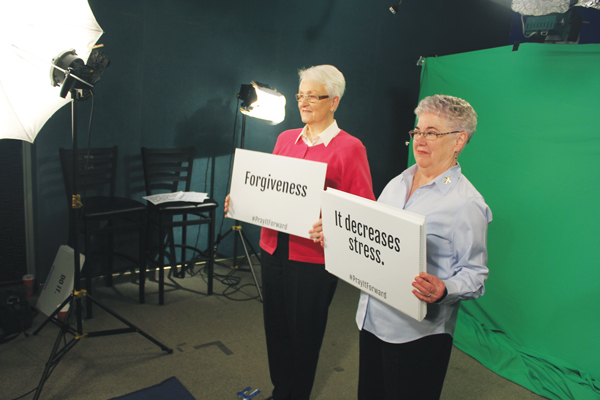 p Sister Mary Ann Vogel of Davenport, Iowa, who belongs to the Congregation of the Humility of Mary, participates in a “Pray It Forward” video shoot with Dominican Sister Mary Hopkins of Sinsinawa, Wisc., at Loras College in Dubuque. Photo © Catholic News Service/Jessi Russo, The Witness