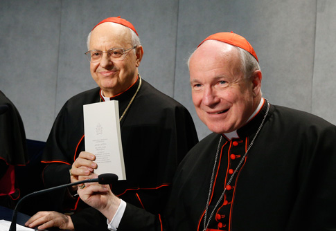 Cardinal Lorenzo Baldisseri, general secretary of the Synod of Bishops, and Austrian Cardinal Christoph Schonborn, holds a copy of Pope Francis' apostolic exhortation on the family, "Amoris Laetitia" ("The Joy of Love"), during a news conference for the document's release at the Vatican April 8. The exhortation is the concluding document of the 2014 and 2015 synods of bishops on the family. (CNS photo/Paul Haring) 