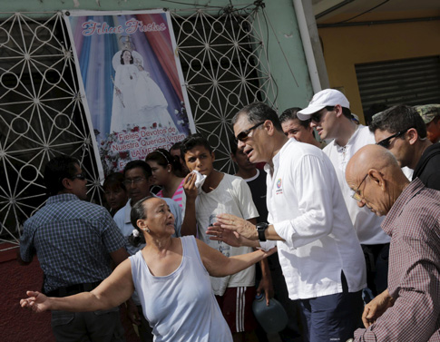 Ecuador’s President Rafael Correa speaks with residents in Portoviejo after an earthquake off the country’s Pacific coast. At least 272 people died, nearly 3,000 were injured and thousands were left homeless in the April 16 magnitude-7.8 earthquake. (Photo © Catholic News Service/ Henry Romero, Reuters)