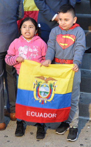 Youngsters outside St. Leo’s Church in Corona, display the Ecuadorian colors while prayers were offered for the earthquake victims. 