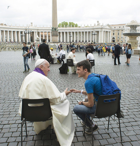 Pope Francis hears confession of a youth April 23 in St. Peter’s Square at the Vatican. (Photo © Catholic News Service/L’Osservatore Romano via Reuters)