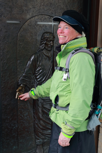 American pilgrim Ann Sieben prepares to enter Quebec City’s Basilica-Cathedral Notre-Dame through its Holy Door March 24. As a pilgrim, Sieben walked more than 3,100 miles from her hometown of Denver, arriving just in time for the Easter triduum. (Photo © Catholic News Service/ Philippe Vaillancourt, Presence)