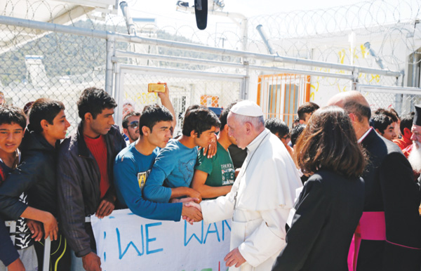 Pope Francis meets refugees at the Moria refugee camp on the island of Lesbos, Greece, April 16. (Photo: Catholic News Service/Paul Haring)