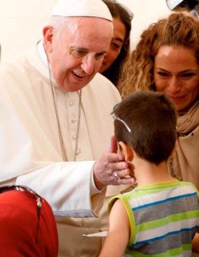 Pope Francis greets a boy as he meets refugees at the Moria refugee camp on the island of Lesbos, Greece, April 16, 2016. (Photo: Catholic News Service/Paul Haring)