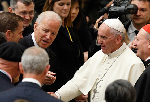 U.S. Vice President Joe Biden gestures as he meets Pope Francis after both leaders spoke at a conference on adult stem-cell research at the Vatican. (Photo © Catholic News Service/ Paul Haring)
