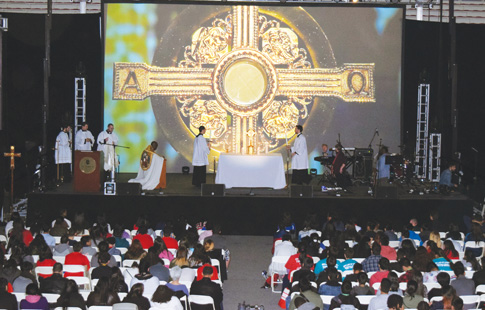 Father Dwayne Davis, parochial vicar at St. Thomas Aquinas, Flatlands, led the eucharistic adoration at Brooklyn Catholic Youth Day at St. John’s University, Jamaica. The day-long event was filled with prayer, music and fun and was part of a three-day weekend dedicated to young Catholics that drew close to 3,000 participants.