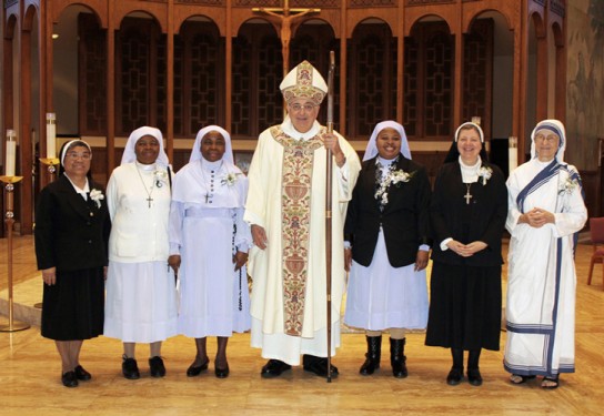 Bishop DiMarzio with silver jubilarians, from left, Sister of St. John the Baptist Sister Amelia Marie Cueva; Daughters of Mary Mother of Mercy Sisters James Marie Onwuka, Mary Lucia Odor and Mary Ngozi Ohaeri; Visitation of Holy Mary Sister Susan Marie Kasprzak; and Missionary of Charity Sister M. Stefana Adamiak.