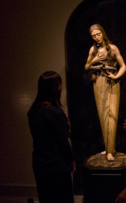 St. Mary Magdalene is shown meditating on the crucifix in this painted wooden sculpture that is part of The Sacred Made Real exhibit in 2010 at the National Galley of Art in Washington. (CNS photo/Nancy Wiechec) 