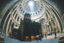 Tourists and Christian pilgrims visit the tomb where it is believed Christ was buried inside the Church of the Holy Sepulcher in Jerusalem. For the first time in 200 years, experts have begun a restoration of the Edicule of the Tomb. (Photo © Catholic News Service/ Jim Hollander, EPA)