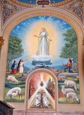 A mural depicting the appearance of Our Lady at Fatima and the “secrets” of Fatima graces one of the back wall panels at St. Joseph’s Co-Cathedral, Prospect Heights.