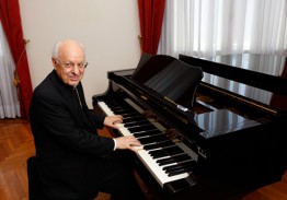 Cardinal Lorenzo Baldisseri, general secretary of the Synod of Bishops, plays the piano in his office at the Vatican. 