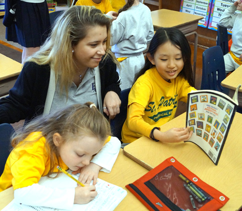 Students from Fontbonne Hall Academy work with St. Patrick Catholic Academy’s students as part of a class. (Photo courtesy St. Patrick Catholic Academy)